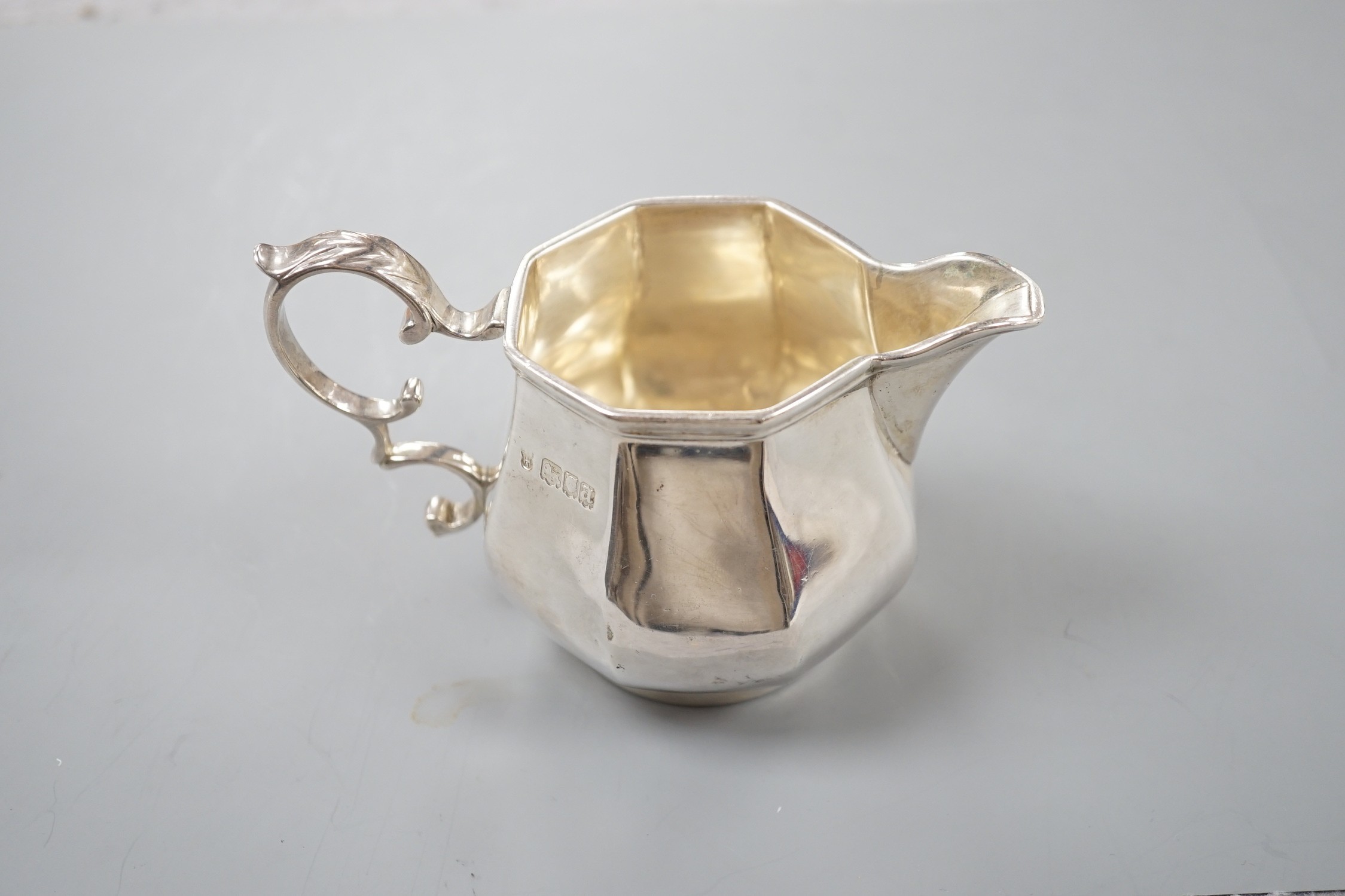 A George V silver panelled cream jug, Charles Stuart Harris & Sons, London, 1916, 82mm, 6.5oz.